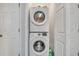 Stackable washer and dryer in a well-lit laundry closet at 2347 Tall Sail Dr # J, Charleston, SC 29414