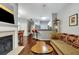 Living room with hardwood floors, fireplace, and a view into the kitchen at 2347 Tall Sail Dr # J, Charleston, SC 29414