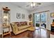 Living room with hardwood floors, sofa, and sliding glass door to deck at 2347 Tall Sail Dr # J, Charleston, SC 29414