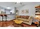 Living room features hardwood floors, a sofa, and a view to the kitchen at 2347 Tall Sail Dr # J, Charleston, SC 29414