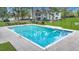 Inviting community pool surrounded by lush landscaping at 2347 Tall Sail Dr # J, Charleston, SC 29414
