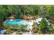 Community pool with clubhouse and surrounding trees at 2652 Doubletree Ct, Charleston, SC 29414