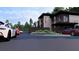 Contemporary building with balcony, landscaping, and luxury cars parked nearby at 3100 Fickling Hill Rd # 8, Johns Island, SC 29455