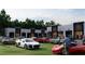 Luxury car display in front of a modern commercial building with large garage doors at 3100 Fickling Hill Rd # 8, Johns Island, SC 29455