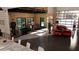 Modern garage interior with a red sports car, open floor plan, and a mezzanine at 3100 Fickling Hill Rd # 8, Johns Island, SC 29455