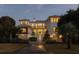 Two-story home illuminated at night at 3213 Middle St, Sullivans Island, SC 29482