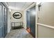 Apartment entry hallway with glass-top console table and mirror at 330 Concord St # 11C, Charleston, SC 29401