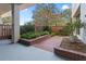 Private brick patio with lush landscaping and seating area at 330 Concord St # 11C, Charleston, SC 29401