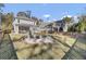 Property with a large backyard, screened porch, and fire pit at 496 Oak View Way, Summerville, SC 29483