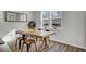 Bright dining area with a wood table and metal chairs near a window at 496 Oak View Way, Summerville, SC 29483