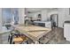 Dining area with a wood table and chairs, kitchen view, and access to a patio at 496 Oak View Way, Summerville, SC 29483