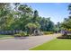Community entrance with brick pillars and lush landscaping at 496 Oak View Way, Summerville, SC 29483