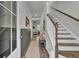 Bright entryway with stairs, wood floors, and a view to the living room at 496 Oak View Way, Summerville, SC 29483