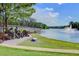 Lakefront view with sculptures and fountain at 496 Oak View Way, Summerville, SC 29483