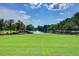 Lakefront park with fountain and grassy area at 496 Oak View Way, Summerville, SC 29483