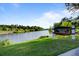 Village pond with lush green landscape at 496 Oak View Way, Summerville, SC 29483