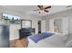 Spacious bedroom with hardwood floors, ceiling fan and large TV at 540 Pointe Of Oaks Rd, Summerville, SC 29485