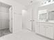 Updated bathroom with white cabinets and walk-in closet at 569 Trotters Ln # 222, Moncks Corner, SC 29461