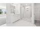 Clean bathroom featuring white vanity, marble tile, and a glass shower at 569 Trotters Ln # 222, Moncks Corner, SC 29461