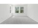 Cozy bedroom with grey carpet, fresh paint, and treetop views at 569 Trotters Ln # 222, Moncks Corner, SC 29461