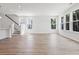Spacious living room featuring hardwood floors and large windows at 569 Trotters Ln # 222, Moncks Corner, SC 29461