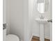 Small powder room with pedestal sink, toilet and round mirror at 569 Trotters Ln # 222, Moncks Corner, SC 29461