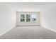 Well-lit bedroom with grey carpet and a view at 573 Trotters Ln # 220, Moncks Corner, SC 29461