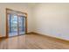 Bright bedroom featuring hardwood floors and sliding glass doors to a deck at 581 Flannery Pl, Mount Pleasant, SC 29466