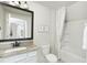 Small bathroom with granite-topped vanity, white cabinets, and a bathtub shower combo at 763 Blue Iris Way, Summerville, SC 29486