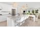 Spacious kitchen with white cabinets, granite countertops, and an island with seating at 763 Blue Iris Way, Summerville, SC 29486