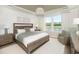 Main bedroom with wood-look flooring and large window offering natural light at 763 Blue Iris Way, Summerville, SC 29486