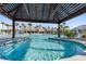 Relaxing resort-style pool with a pergola and plenty of lounge chairs at 763 Blue Iris Way, Summerville, SC 29486