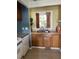 Simple kitchen with wood cabinets and double sink at 8821 Peters Point Rd, Edisto Island, SC 29438