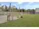 Spacious backyard with grassy area, patio, and string lights at 1011 Mossy Rock Dr, Summerville, SC 29485