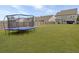 Large backyard with trampoline and view of house at 1011 Mossy Rock Dr, Summerville, SC 29485