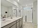 Elegant bathroom with dual vanity, large shower, and modern fixtures at 1011 Mossy Rock Dr, Summerville, SC 29485
