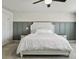 Spacious bedroom with large bed, gray accent wall, and ceiling fan at 1011 Mossy Rock Dr, Summerville, SC 29485
