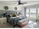 Spacious bedroom with a metal bed frame, window seating, and a large window at 1011 Mossy Rock Dr, Summerville, SC 29485
