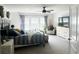 Bright and airy bedroom with a comfy bed, large windows, and a sitting area at 1011 Mossy Rock Dr, Summerville, SC 29485