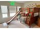 bedroom with bunk beds, slide, and dinosaur theme decor at 1011 Mossy Rock Dr, Summerville, SC 29485