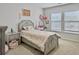 Light and airy bedroom with a twin-size bed, dresser and desk at 1011 Mossy Rock Dr, Summerville, SC 29485