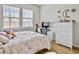 Cozy bedroom with a bed, dresser, and workspace with plenty of natural light at 1011 Mossy Rock Dr, Summerville, SC 29485