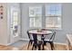 Bright breakfast nook features a round table and four chairs, perfect for enjoying meals at 1011 Mossy Rock Dr, Summerville, SC 29485