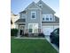 Two-story house with gray siding, stone accents, and a landscaped lawn at 1011 Mossy Rock Dr, Summerville, SC 29485