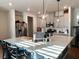 Modern kitchen with white cabinets, quartz countertops, and island at 1011 Mossy Rock Dr, Summerville, SC 29485