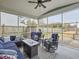 Relaxing screened porch with wicker furniture and fire pit at 1011 Mossy Rock Dr, Summerville, SC 29485