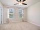 Bright bedroom with ceiling fan and two windows at 113 Corvus St, Summerville, SC 29483