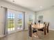 Dining room with table and chairs, and access to backyard at 113 Corvus St, Summerville, SC 29483