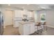 Island kitchen with granite countertops, stainless steel appliances, and white cabinets at 113 Corvus St, Summerville, SC 29483