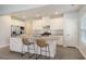 Island kitchen with granite countertops, stainless steel appliances, and white cabinets at 113 Corvus St, Summerville, SC 29483